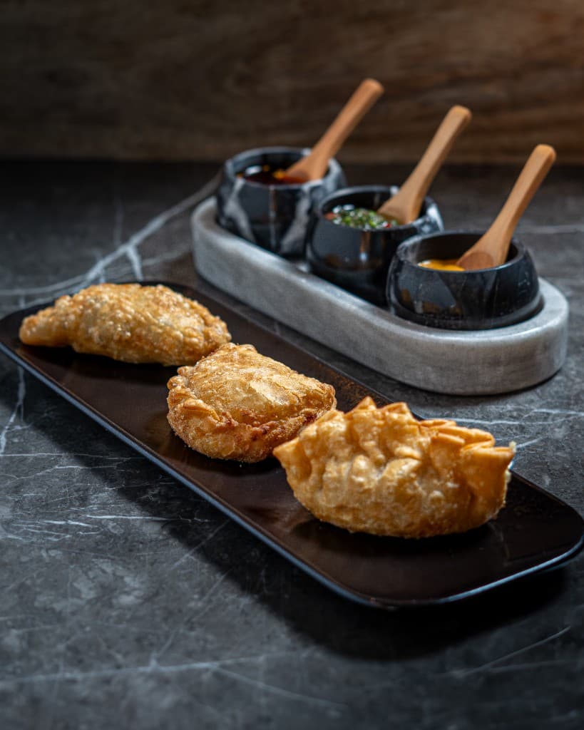 Empanadas and dipping sauces at Fuego Vivo Happy Hour